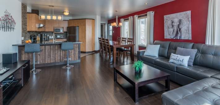 Salon, cuisine et salle à diner - Chalet à louer Charlevoix