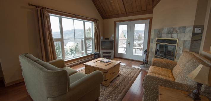 Salon de ce chalet à louer Petite-Rivière St-François - Chalet à louer Charlevoix