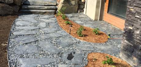 Local stones used for landscaping work, for an harmonious look with the outside finishing of Ilaali at Petite Rivière St-François.
