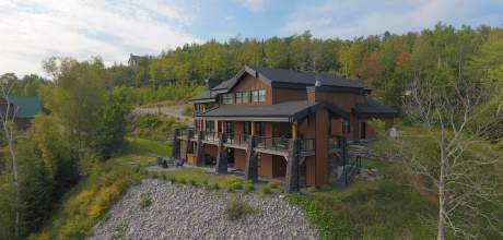 Fully landscaped Ilaali, honoring the flora and geology of Charlevoix.